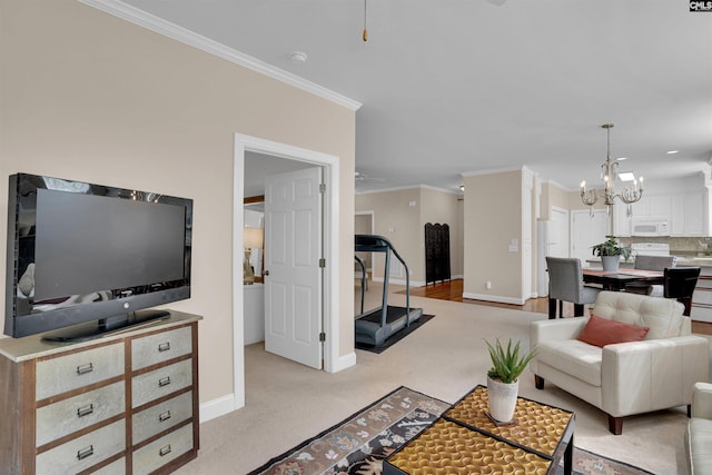 living room with crown molding, ceiling fan with notable chandelier, light carpet, and baseboards