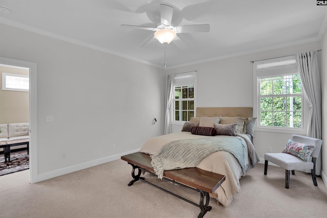 bedroom with baseboards, a ceiling fan, light carpet, and crown molding