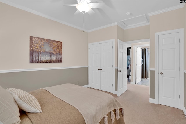 bedroom featuring attic access, a closet, baseboards, ornamental molding, and light colored carpet