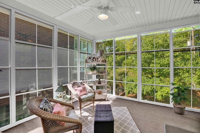 sunroom featuring ceiling fan