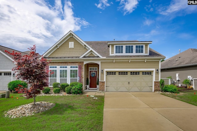craftsman house with a shingled roof, a front lawn, concrete driveway, and stone siding