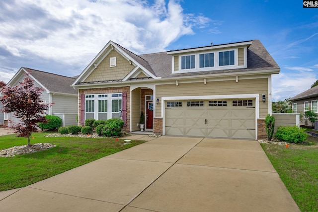 craftsman house featuring roof with shingles, concrete driveway, a front lawn, and a garage