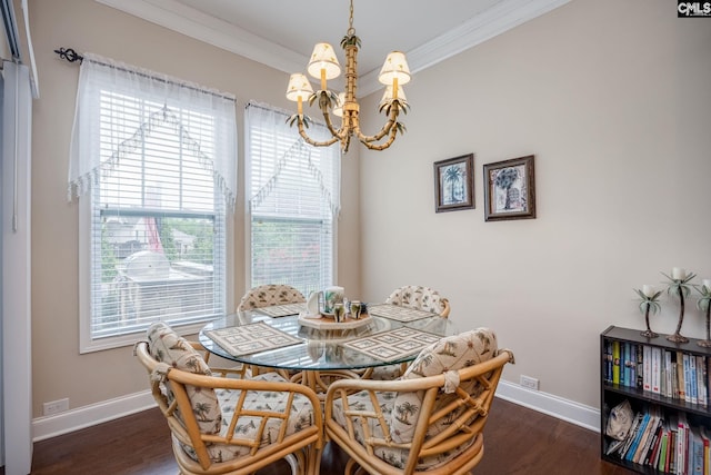 dining room with a chandelier, baseboards, dark wood-style flooring, and crown molding