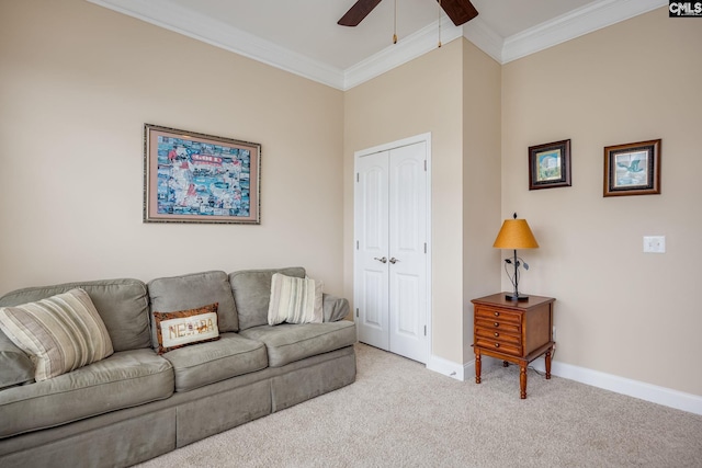 living room with carpet, ceiling fan, crown molding, and baseboards