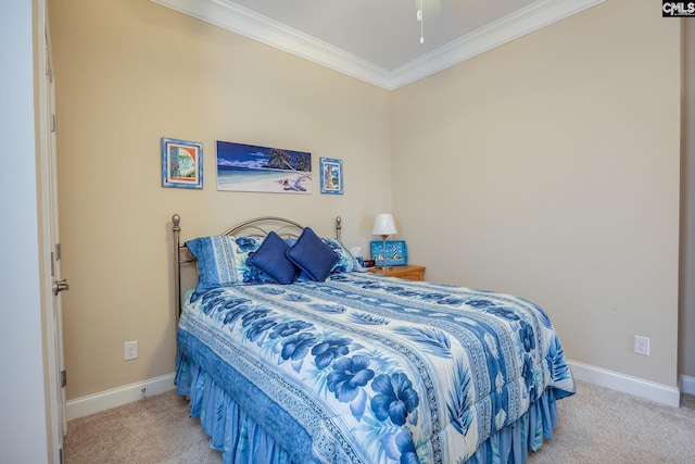bedroom featuring baseboards, ornamental molding, and carpet