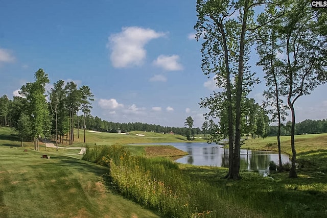 surrounding community featuring view of golf course, a water view, and a yard