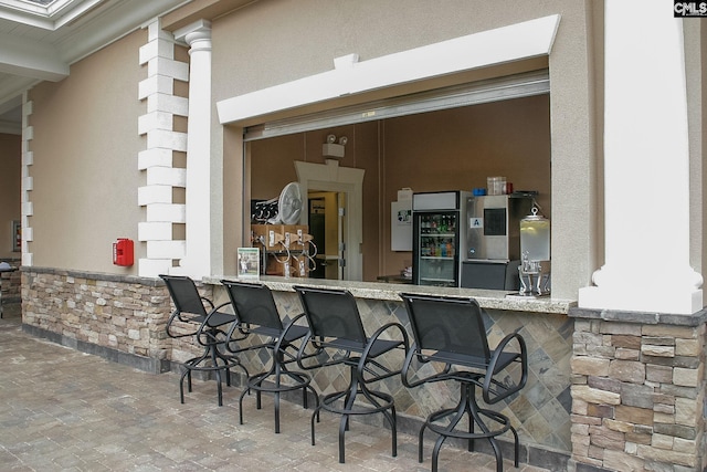 view of patio / terrace featuring outdoor wet bar