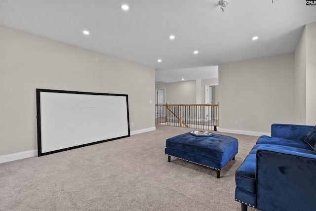 living area with an upstairs landing, recessed lighting, baseboards, and light carpet