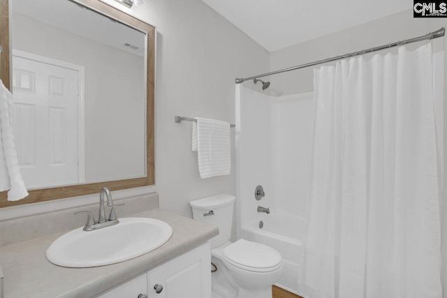 bathroom with shower / bath combo with shower curtain, vanity, toilet, and visible vents