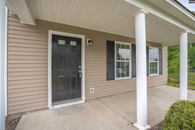 property entrance featuring covered porch