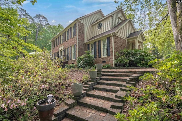exterior space featuring brick siding