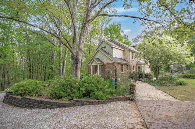 view of front of house featuring brick siding