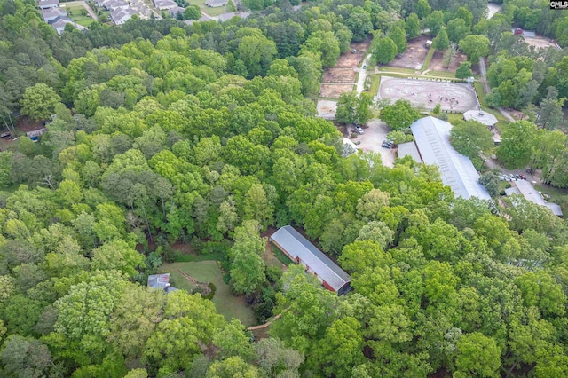 drone / aerial view featuring a view of trees