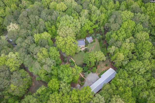 birds eye view of property with a wooded view