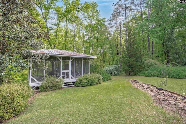 view of yard featuring a sunroom
