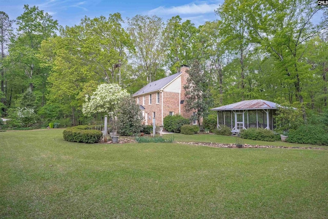 view of yard with a sunroom