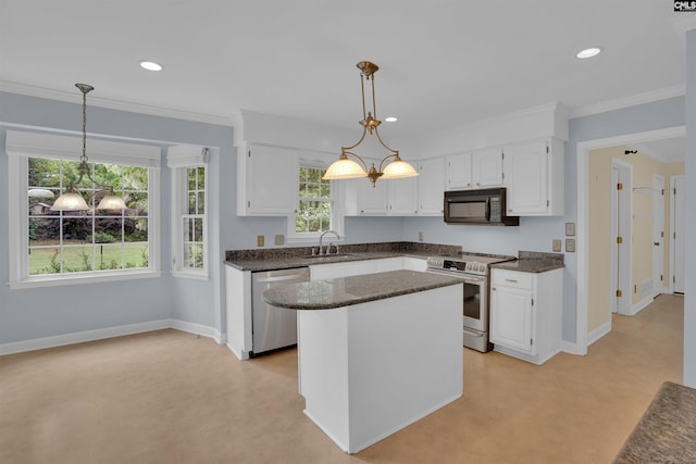 kitchen with appliances with stainless steel finishes, recessed lighting, white cabinets, and baseboards