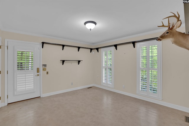 interior space featuring visible vents, ornamental molding, and baseboards