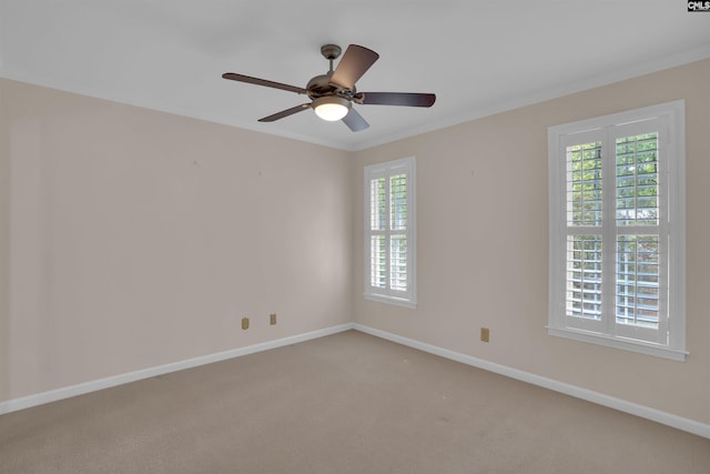 empty room with baseboards, a ceiling fan, and carpet flooring