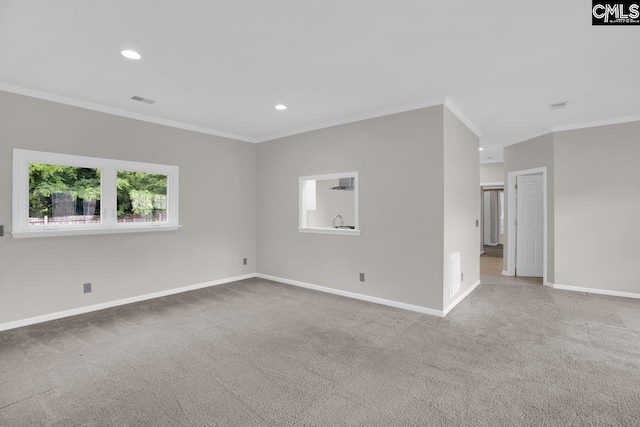 carpeted empty room with crown molding, recessed lighting, visible vents, and baseboards