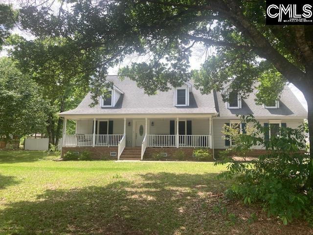 cape cod-style house with a front yard, crawl space, and covered porch