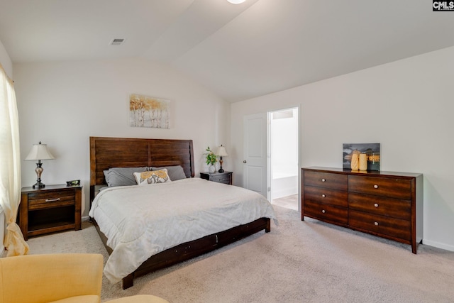 carpeted bedroom with baseboards, vaulted ceiling, and visible vents