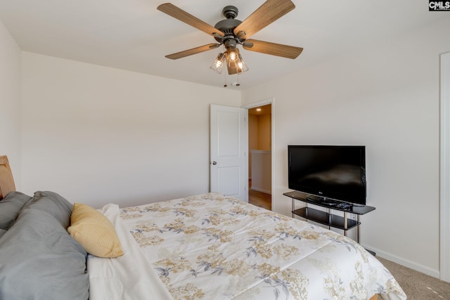 carpeted bedroom with baseboards and ceiling fan