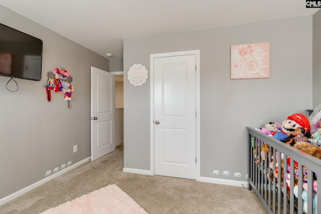 bedroom featuring baseboards and carpet flooring