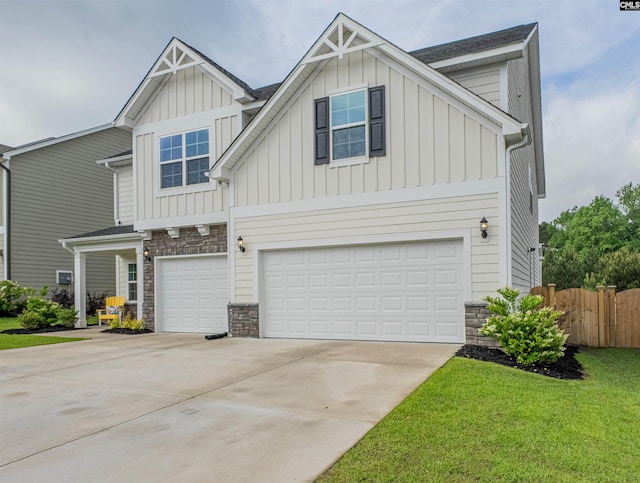 craftsman inspired home featuring board and batten siding, fence, a garage, stone siding, and concrete driveway
