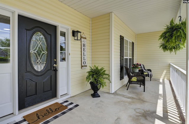 doorway to property featuring covered porch
