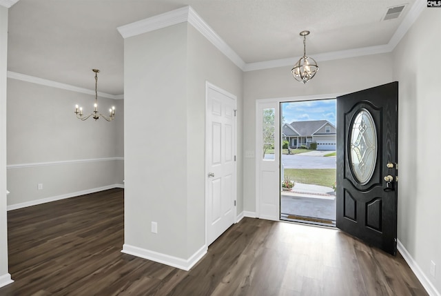 foyer entrance featuring a notable chandelier and dark wood finished floors