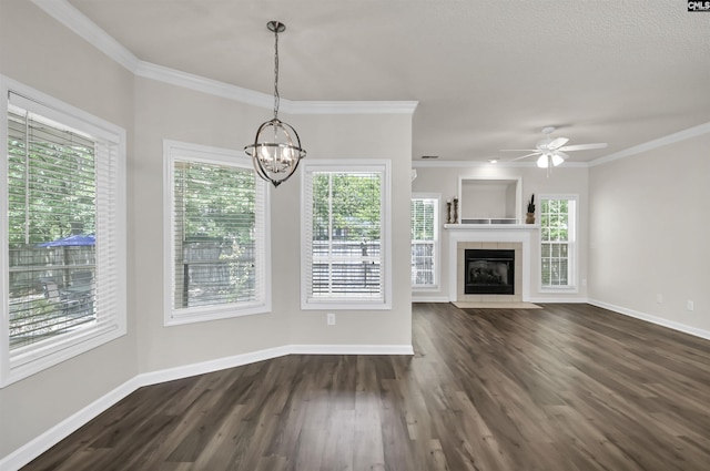 unfurnished living room with dark wood-style flooring, crown molding, and baseboards