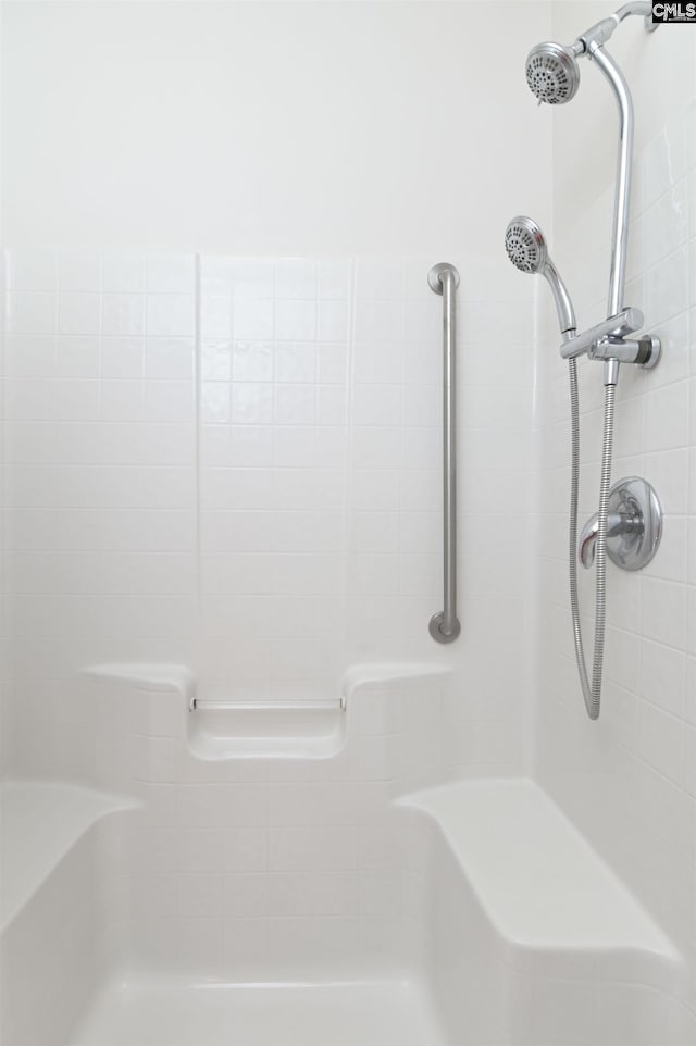 full bathroom with tiled shower