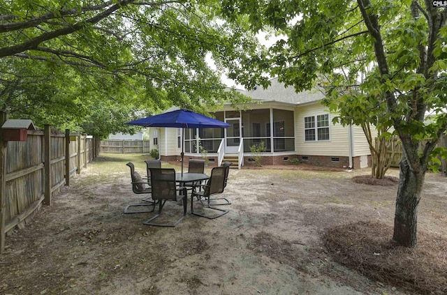 view of patio / terrace with a fenced backyard and a sunroom