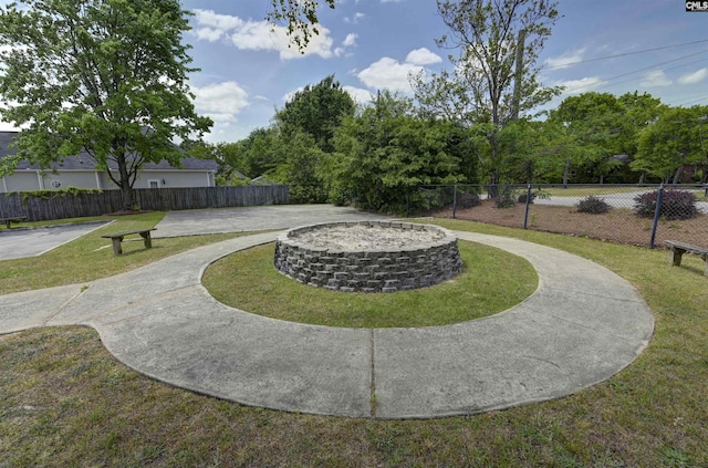 surrounding community featuring a lawn and fence