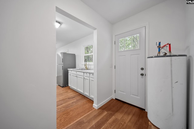1203 Basil Rd, Swansea, SC 29160 - foyer featuring baseboards, light wood-type flooring, and gas water heater