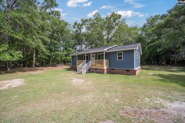 1203 Basil Rd, Swansea, SC 29160 - view of front of house with a front yard, a shingled roof, a porch, and crawl space