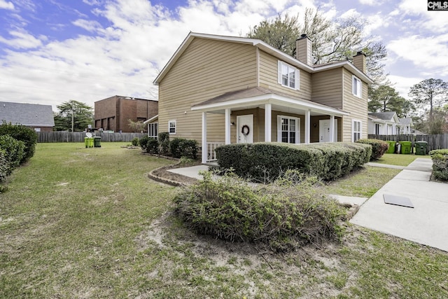 1910 Greenoaks Unit B, Columbia, SC 29206 - view of property exterior featuring a chimney, fence, and a yard