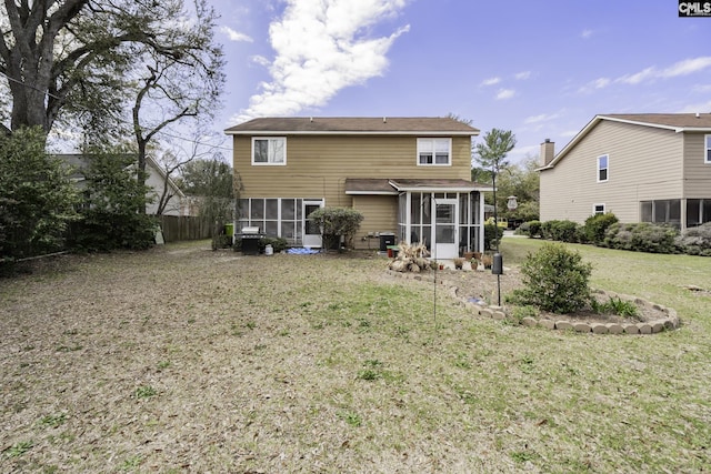 1910 Greenoaks Unit B, Columbia, SC 29206 - back of property featuring fence, a sunroom, and a lawn