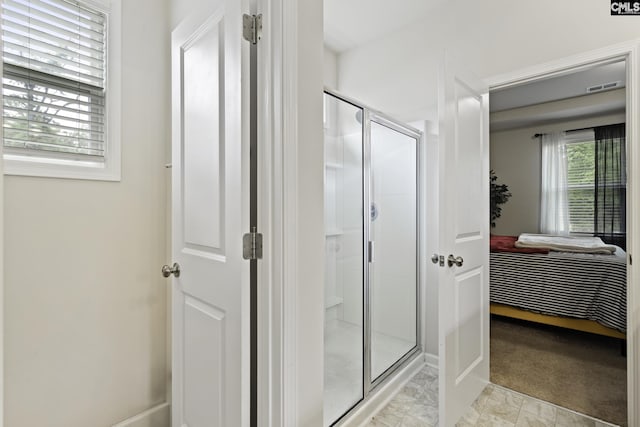 bathroom with visible vents, a shower stall, connected bathroom, and baseboards