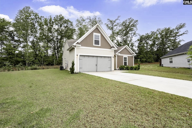 view of front of house with concrete driveway, a garage, a front lawn, and board and batten siding