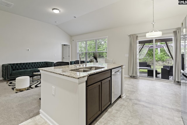 kitchen featuring a sink, visible vents, vaulted ceiling, stainless steel dishwasher, and an island with sink