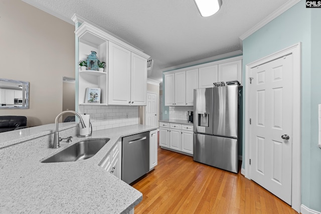 257 Popes Ln, Lexington, SC 29072 - kitchen with appliances with stainless steel finishes, a sink, crown molding, white cabinets, and backsplash