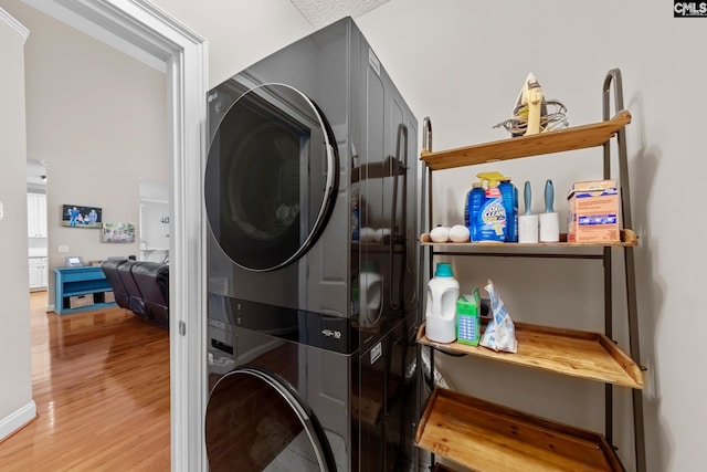 257 Popes Ln, Lexington, SC 29072 - clothes washing area featuring stacked washer / drying machine and light wood-style flooring