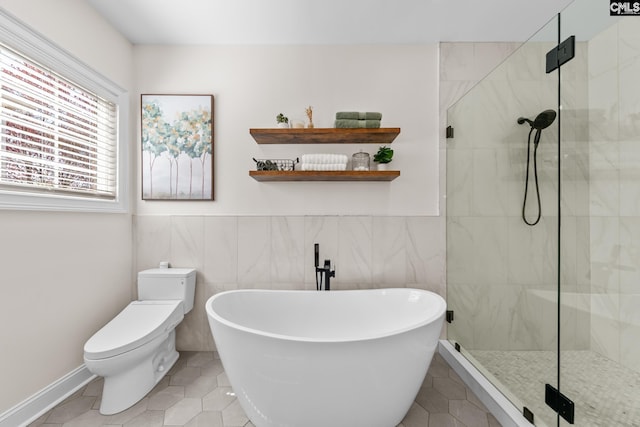 257 Popes Ln, Lexington, SC 29072 - bathroom with a stall shower, a soaking tub, tile patterned flooring, toilet, and tile walls