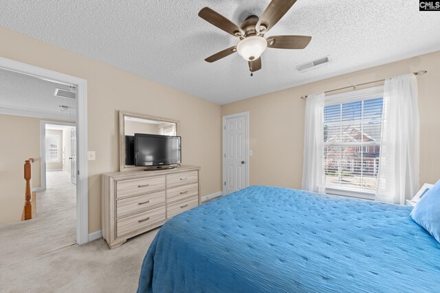 257 Popes Ln, Lexington, SC 29072 - bedroom featuring a textured ceiling, light colored carpet, ceiling fan, and baseboards