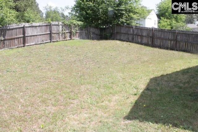 view of yard featuring a fenced backyard