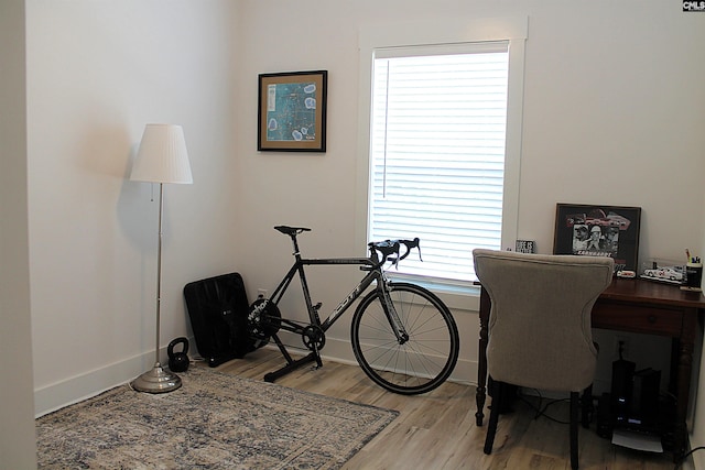office space featuring light wood finished floors and baseboards