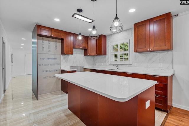 kitchen with recessed lighting, decorative light fixtures, backsplash, and a kitchen island