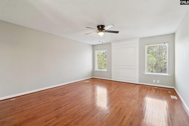 208 Bailey Island Cir, Lexington, SC 29072 - unfurnished room with baseboards, visible vents, wood finished floors, and a ceiling fan